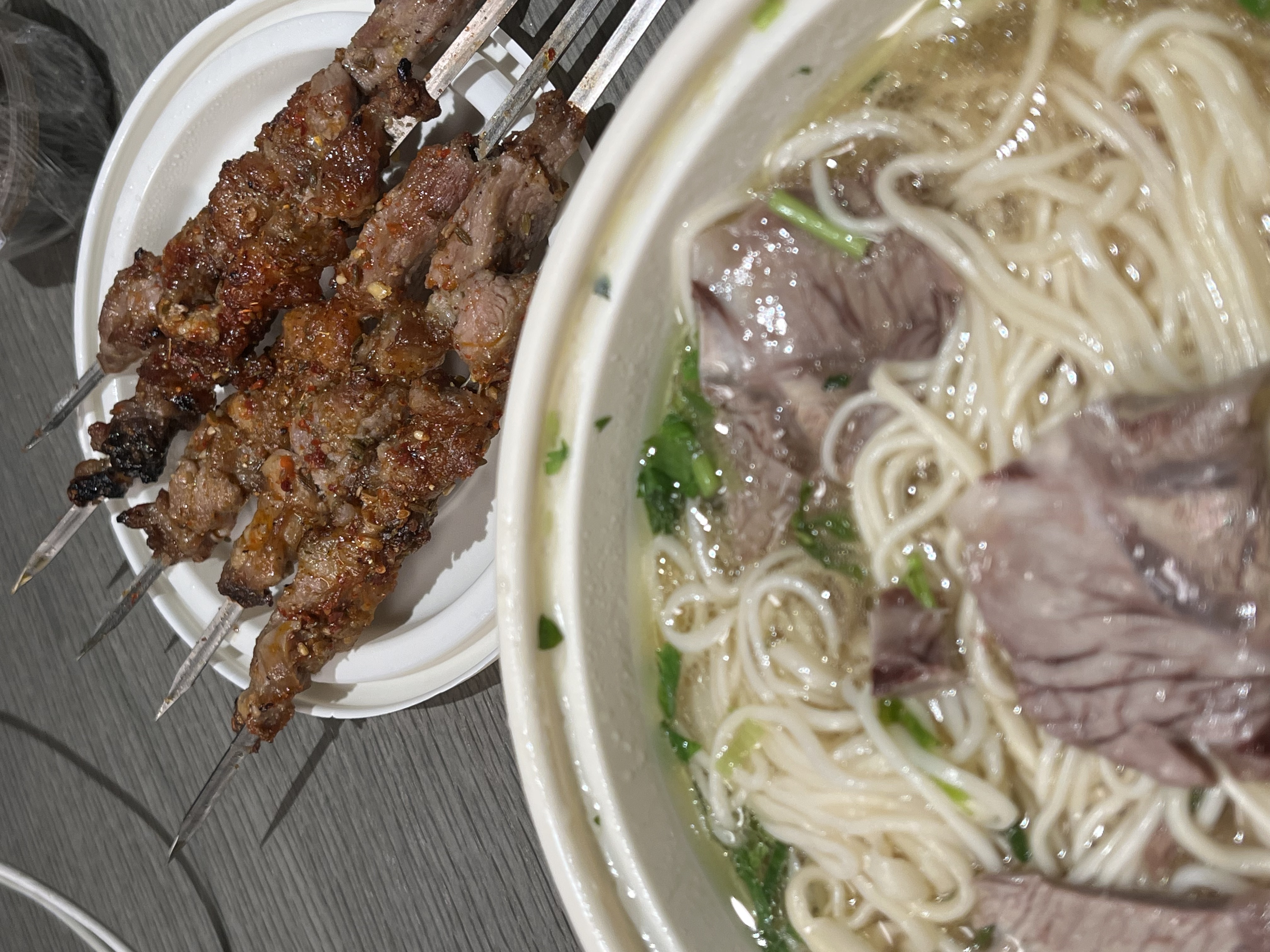 Lamb skewers and noodle soup